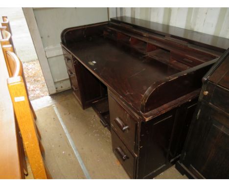 A 1930's mahogany roll top twin pedestal office desk 