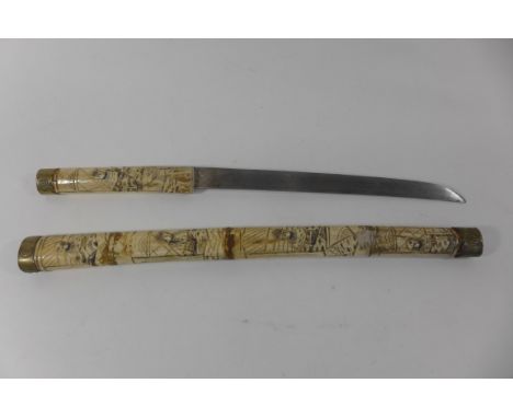 A Japanese bone mounted wakizashi, with 28cm curved single edged blade, the grip and scabbard with extensive carved decoratio