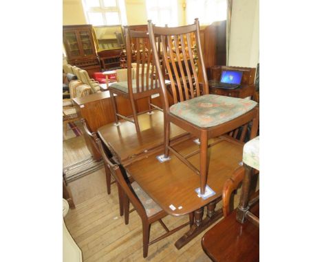 An Ercol medium elm extending dining table and six accompanying chairs (7) 