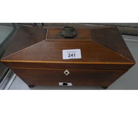 A 19th Century mahogany and inlaid sarcophagus formed tea caddy with fitted interior. 