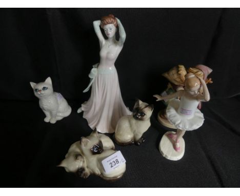 A mixed lot comprising three various Beswick model cats, a Goebel model of two children, a Royal Doulton figurine 'Little Bal