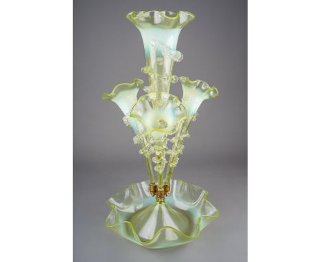 A large Victorian clear and opaline ( uranium) glass epergne, the bowl with wavy rim, four trumpet shaped vases applied spira