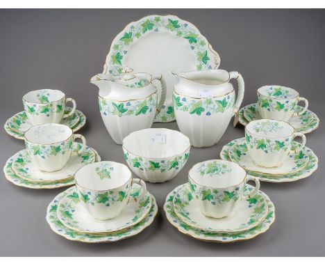 An early 20th Century Royal Crown Derby Ivy Leaf pattern six piece tea service to include: cups, saucers, plates, cake plate,