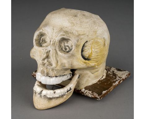 A 19th Century parian inkwell modelled as a skull with recess to top of skull, glazed teeth and articulated mouth, unmarked o