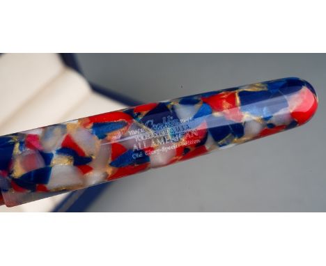 A Modern Conklin red, blue and pearl marble fountain pen, the barrel marked TRADE CONKLIN MARK TOLEDO OHIO USA ALL AMERICAN O