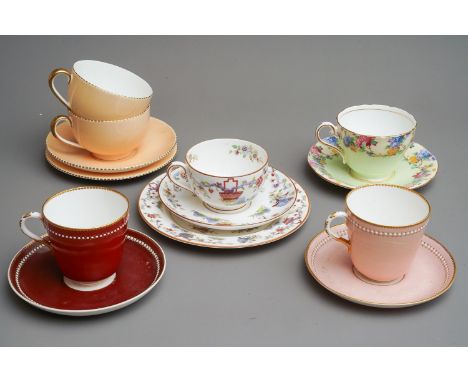 A collection of cups and saucers to include 2 Royal Worcester jewelled cups and saucers, 2 Wedgwood, a Worcester trio painted