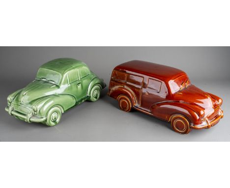 A large Dartmouth style ceramic models of green Morris Minor 1000 and an amber Morris Traveller (2) both with cracks and craz