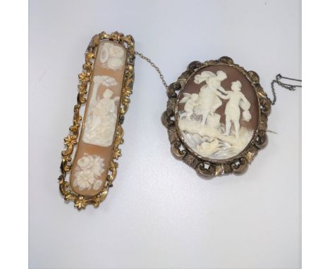 A shell cameo depicting two plaques of flowers and a troubadour playing his lute.  Another cameo depicting a Greek soldier he