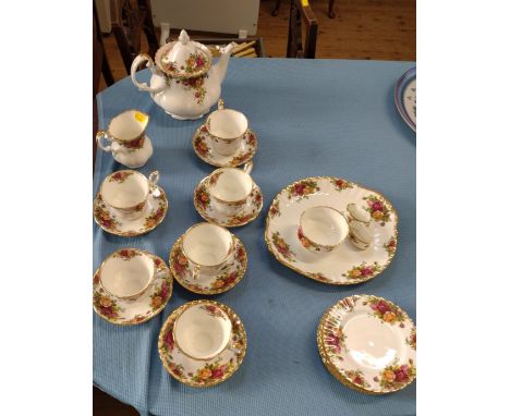 A Royal Albert Old Country Roses tea set comprising teapot, six cups and saucers, six side plates, milk jug, two napkin rings