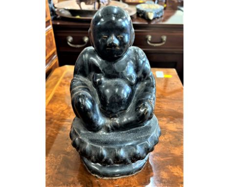 A Vintage Pottery Buddha. Circa 1950. With black glaze. 26cm high. Provenance 80 Rose Street Wokingham 