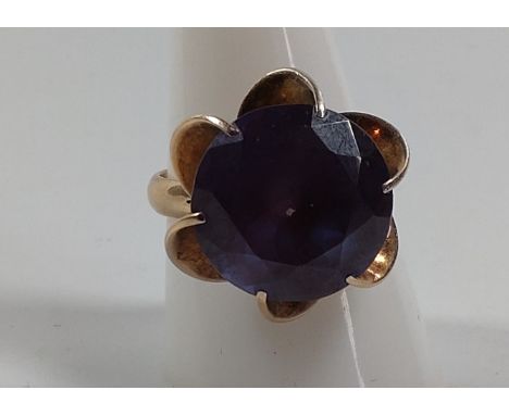 A gold ring marked 14k set with a possible amethyst. Size R. Provenance 80 Rose Street Wokingham. 