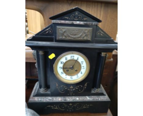 A black marble or slate clock.  Circa 1890. provenance 80 Rose Street Wokingham. 