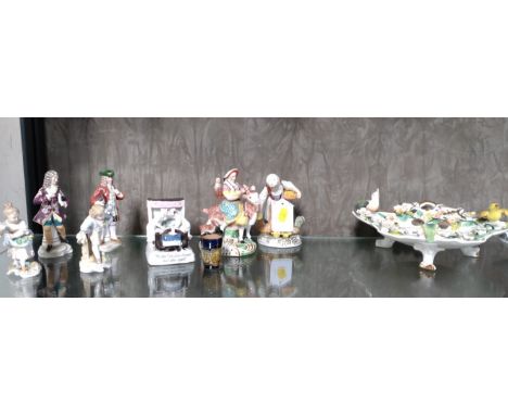 A porcelain three-legged bowl with applied birds and flowers 25cm long, a Fairing "The last in the bed to put out the light",