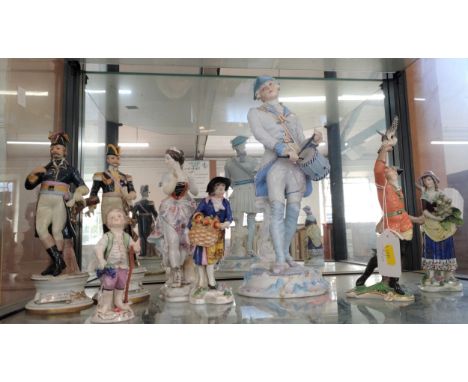 European porcelain figures including Nymphenburg, Capodimonte and a large figure of a drummer 34cm (glue repair to right shoe