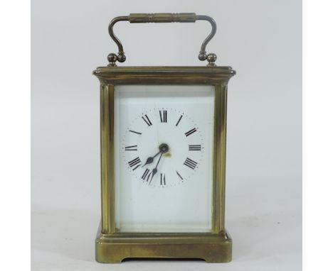 An early 20th century brass cased carriage clock, 15cm tall overall