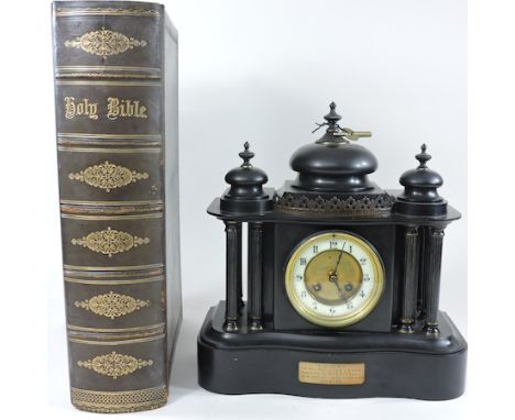 A Victorian black slate mantle clock, 35cm tall, together with a family Bible 