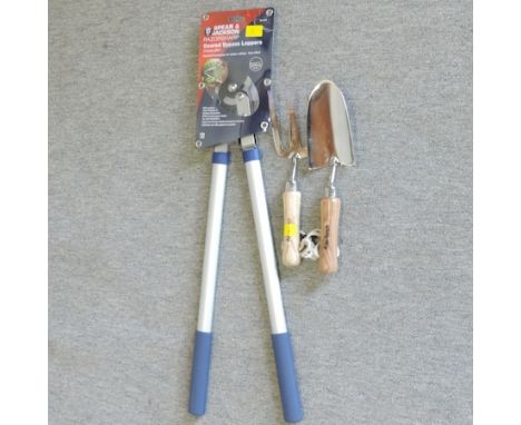 A garden lopper, together with a garden trowel and fork set