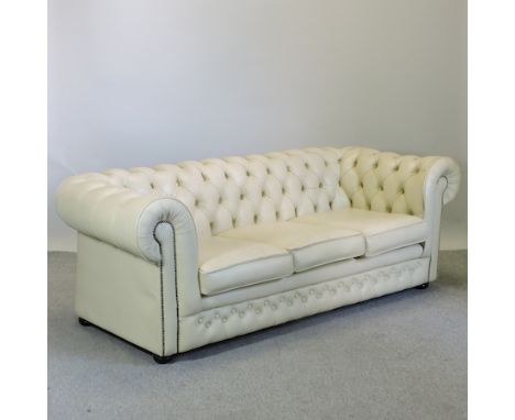 A cream upholstered Chesterfield sofa, with a button back, 200cm