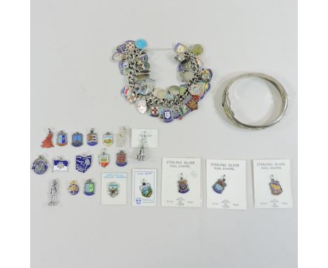 A silver charm bracelet, together with enamel charms and a hinged bangle