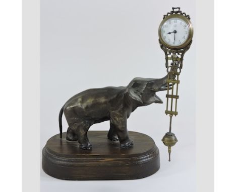 A bronzed elephant mystery clock, 30cm tall overall