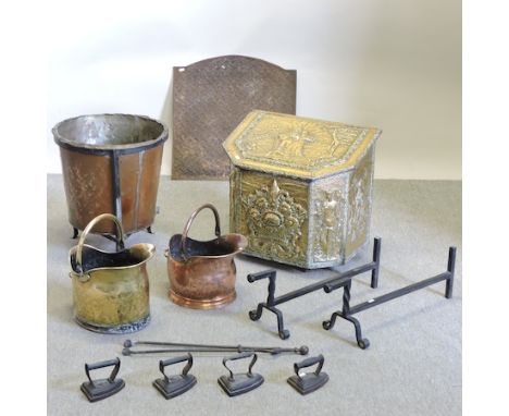 A Victorian embossed brass coal bin, 57cm, together with a fire back, two coal buckets, fire tools and flat irons 