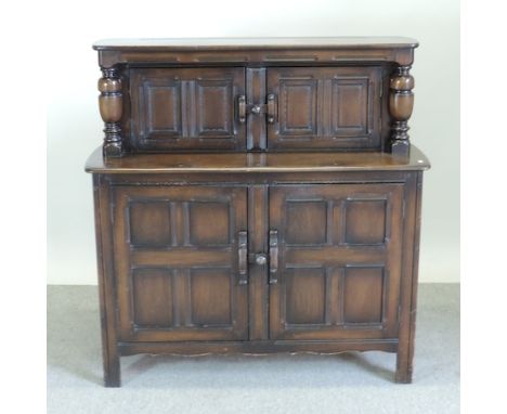 An Ercol dark elm court cupboard, 122cm 