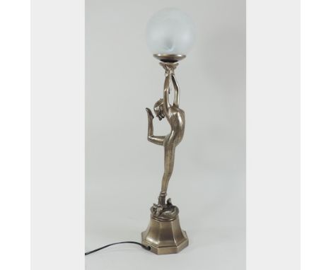An Art Deco style figural lamp, with a white glass shade, 62cm tall