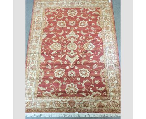 A Ziegler carpet, with all over foliate design, on a red ground, 280 x 200cm 