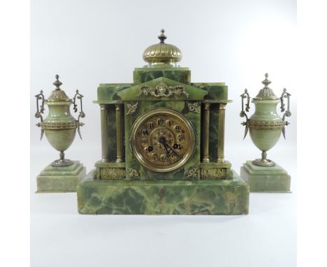 A Victorian green onyx clock garniture, 39cm tall