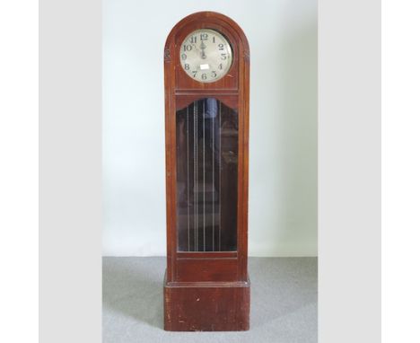 A 1930's oak cased longcase clock, having a three train movement, 184cm tall