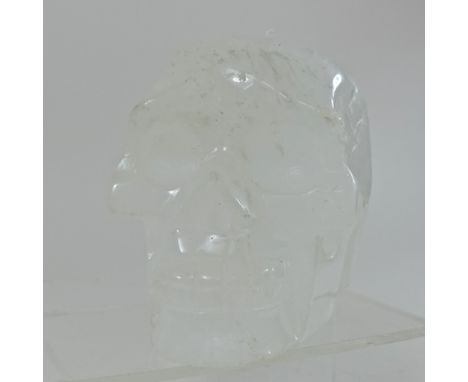 A rock crystal model of a skull, 14cm tall