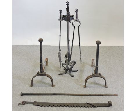 A set of black painted iron fire tools, together with a pair of andirons and other items