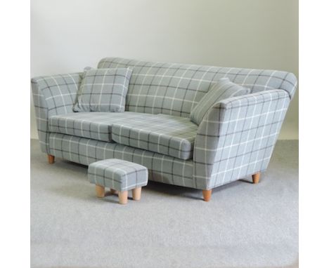 A modern two seater sofa with a grey check upholstery, together with a foot stool, 205cm