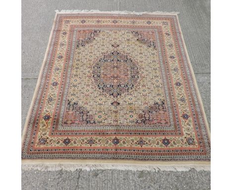 A Persian carpet, on a cream ground, 248 x 303cm 