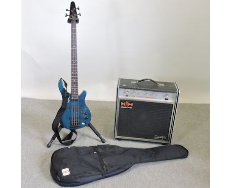 A Tanglewood Rebel bass guitar, in a soft case, with an amp, music stand and guitar stand 