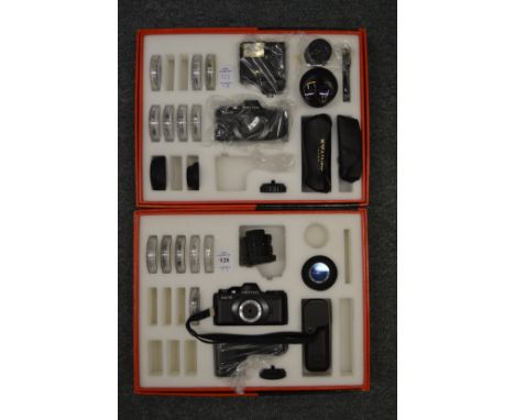 A Pentax Auto 110 camera set and another similar together with a Pentax camera bag.