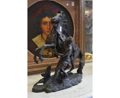 A large spelter model of a Marley horse and handler.
