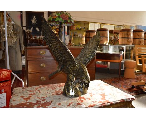 A large cast brass model of a eagle.