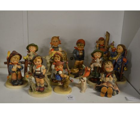 A collection of Goebel and Hummel figures.