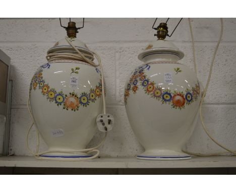 A large pair of floral decorated lamp bases.