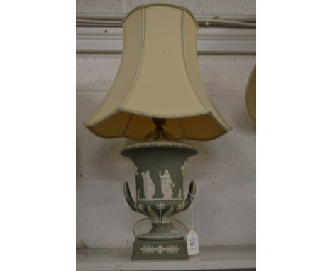 A green jasperware twin handled urn shaped vase lamp.