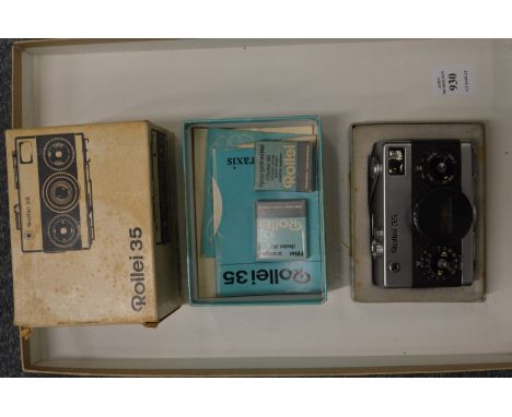 A Rollei 35 camera with original box and accessories.