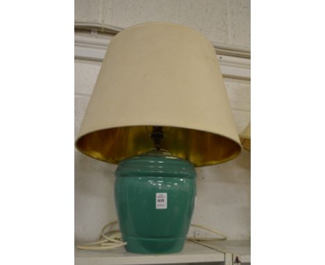 A green glazed pottery table lamp and shade.