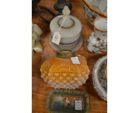 An opaque glass bowl with cover and stand, a glass oil lamp reservoir and a decorative glass dish painted with a stork.