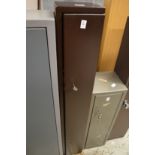 A narrow gun cabinet.