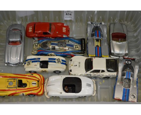 various Porsche and other die cast model cars.