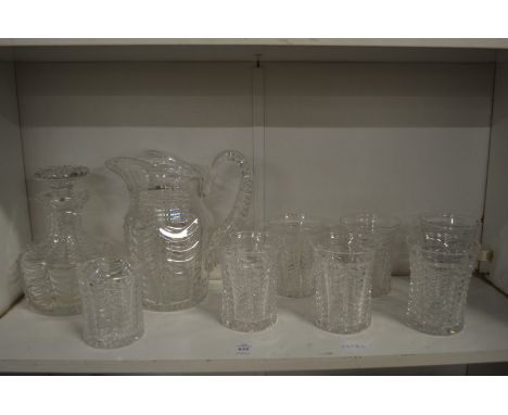 A good Stuart cut glass jug with six tumblers together with a matching decanter and smaller tumbler.