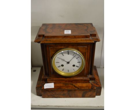 A walnut cased mantle clock.