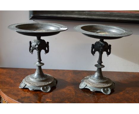 A pair of ornate cast metal tazza with porcelain portrait plaques.