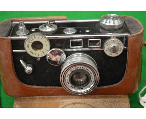 An Argus Cintar 50mm camera with a leather case together with another camera.